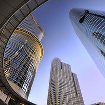 Three glass buildings seen from below 