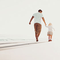 dad and daughter on the beach