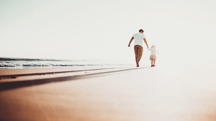 dad and daughter on the beach