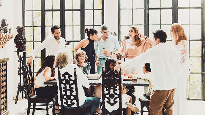 Wealth extended family in opulent dinning room