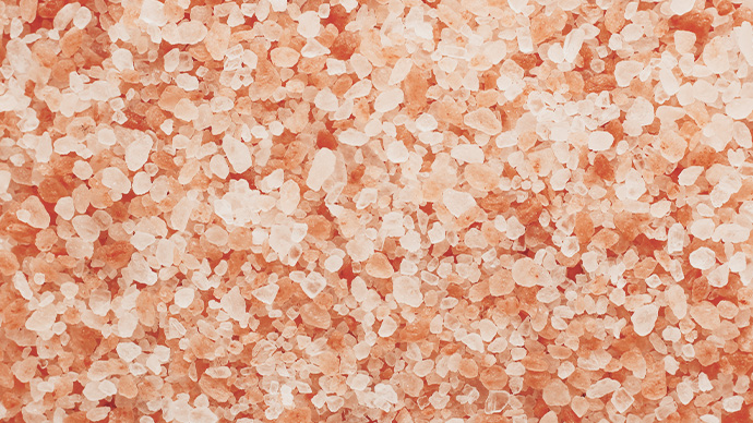 Close up top view of himalayan pink salt texture background with high resolution.