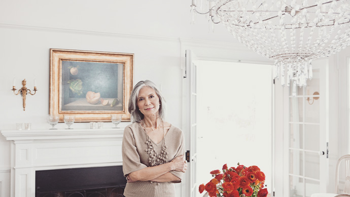 Mature woman in dining room, portrait, smiling