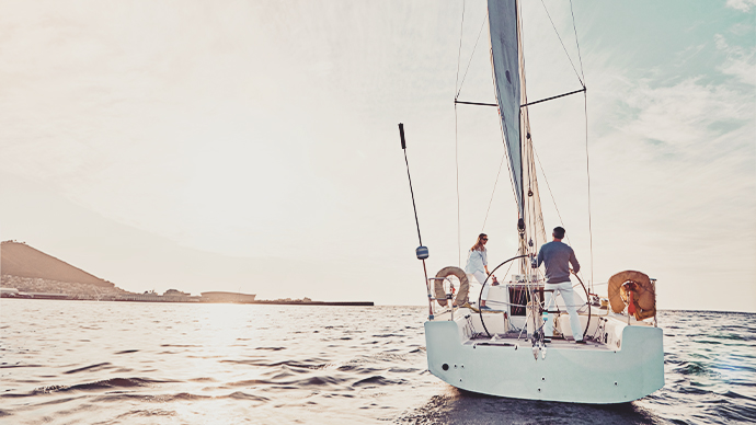 Shot of a couple out sailing on a yacht
