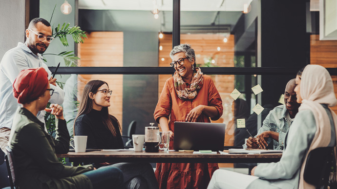 Cheerful businesspeople having a meeting in a boardroom