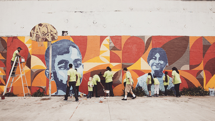 Volunteers painting beautiful mural