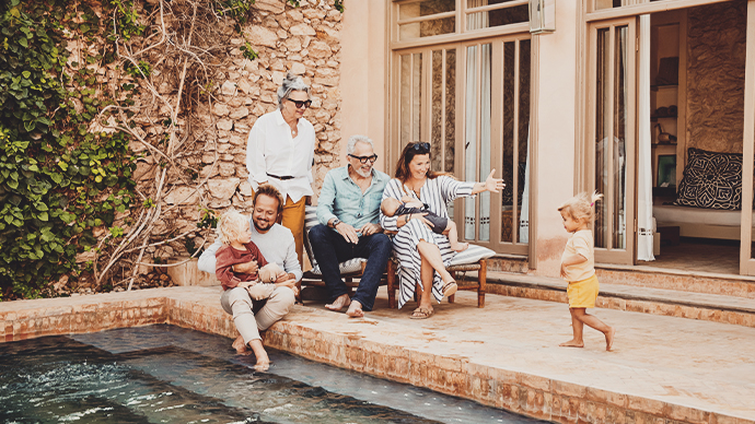 Affluent three generation family poolside