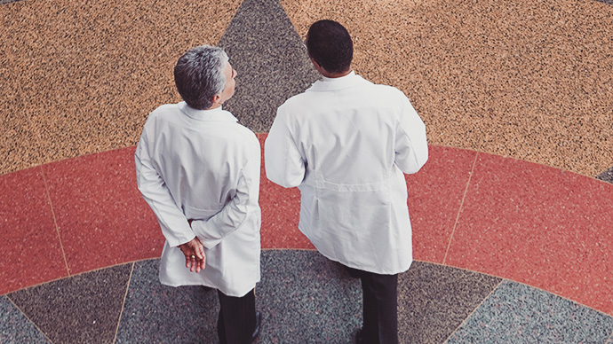 doctors walking along hall