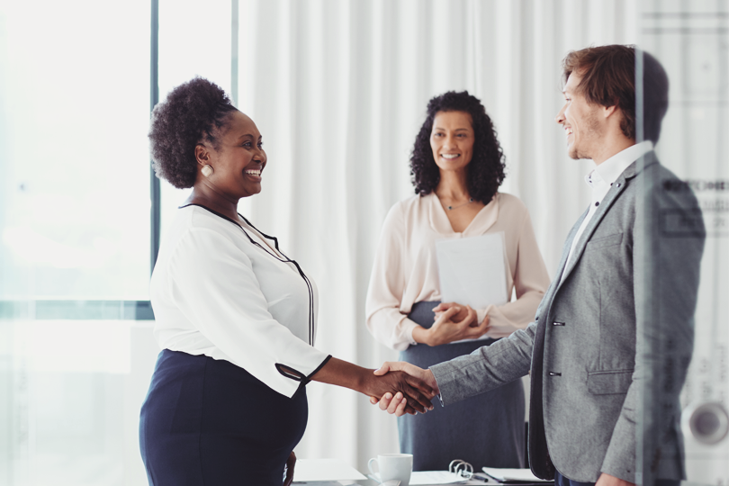 two people on an shake hands agreement