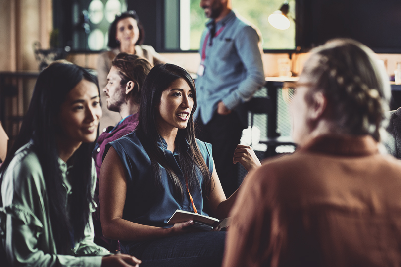 Business people talking in modern office during meeting