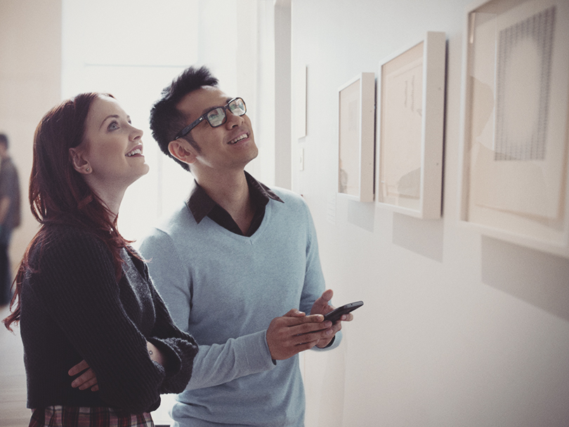 Couple looking at art in a gallery