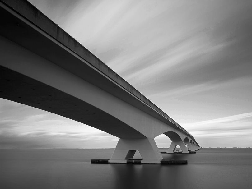 Concrete span built between 1963-65 connecting islands of Schouwen Duiveland and Noord Beveland. Near city of Zierikzee.