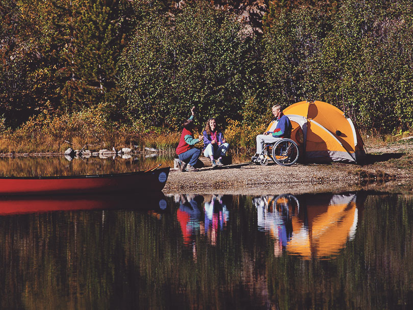 Friends camping by the lake