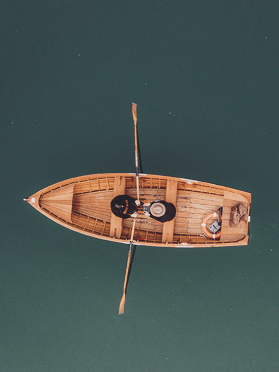 small boat on big water