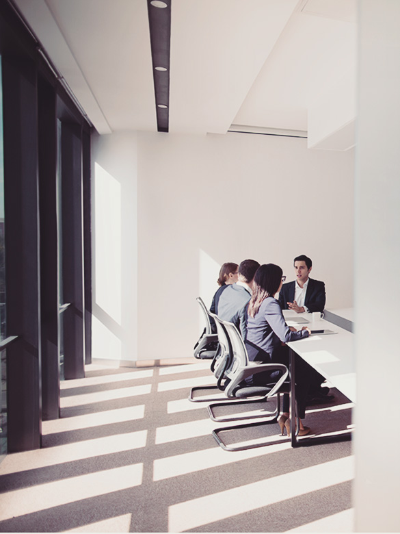 group of office workers in discussion conference room